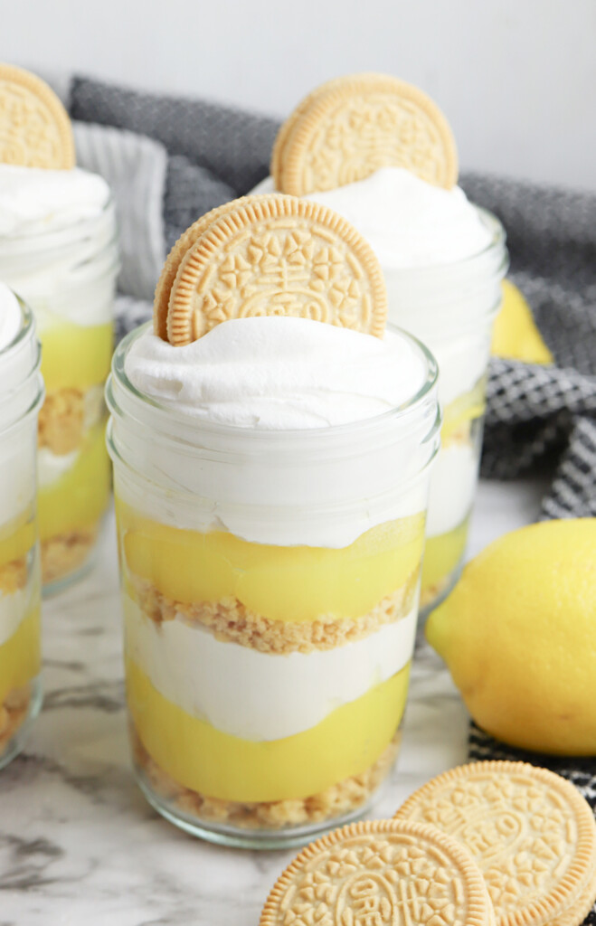 Lemon Parfait with whipped cream and oreo garnish.