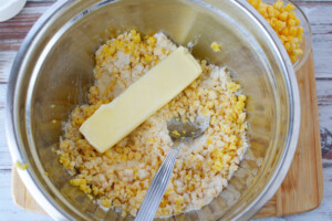 add corn and butter to flour mixture