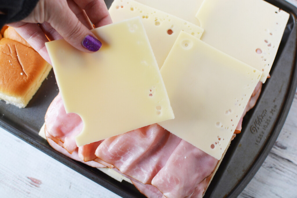 Add more cheese on top of ham.