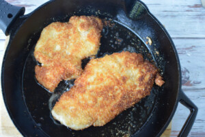 Fry chicken in a skillet