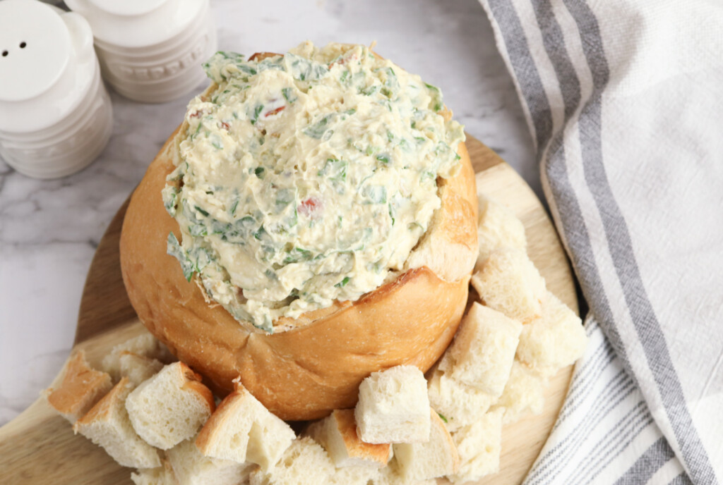 homemade spinach dip being served as an appetizer