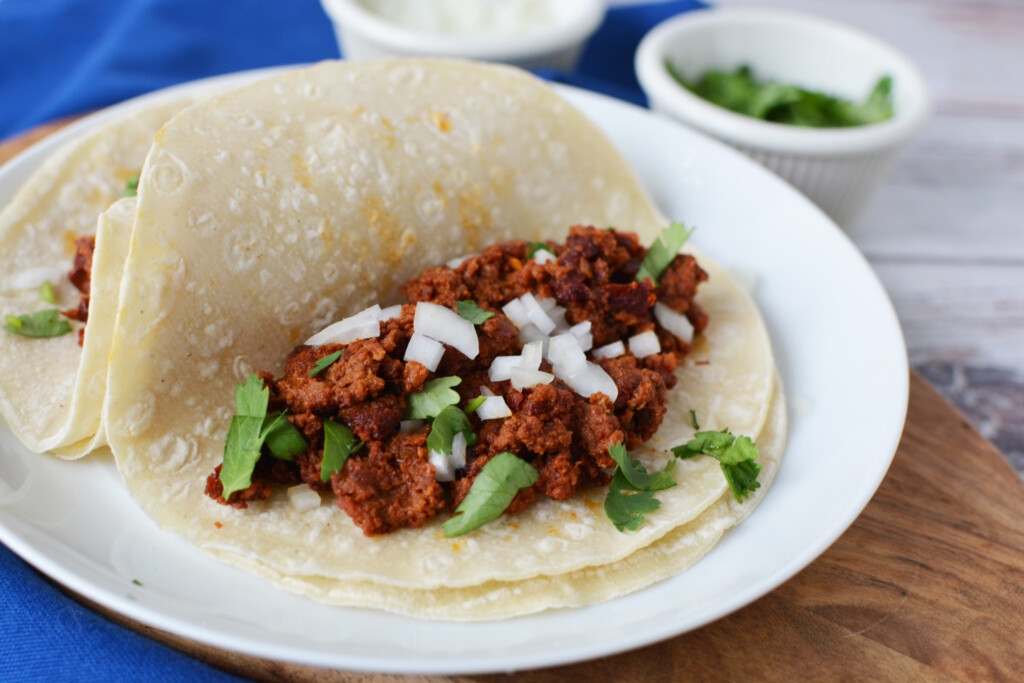 chorizo tacos on a white plate