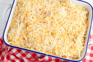 Transfer to baking dish and top with cheese.