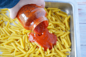 Add marinara sauce to pasta.