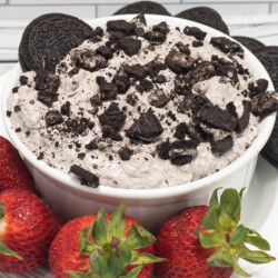 Oreo Dip in a white bowl with strawberries
