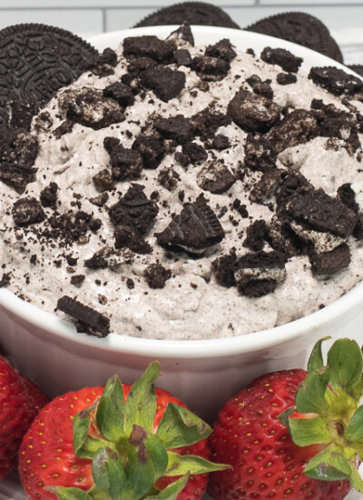 Oreo Dip in a white bowl with strawberries