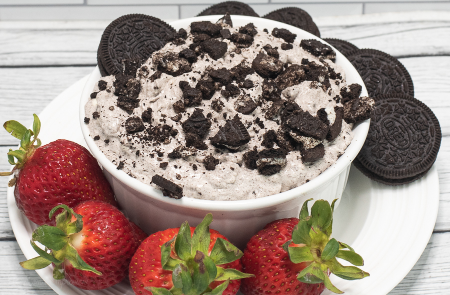 Oreo Dip in a white bowl with strawberries