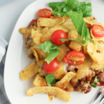 easy frito pie sitting on a white plate.