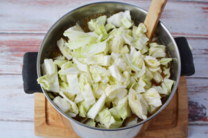 Add cabbage to the soup.